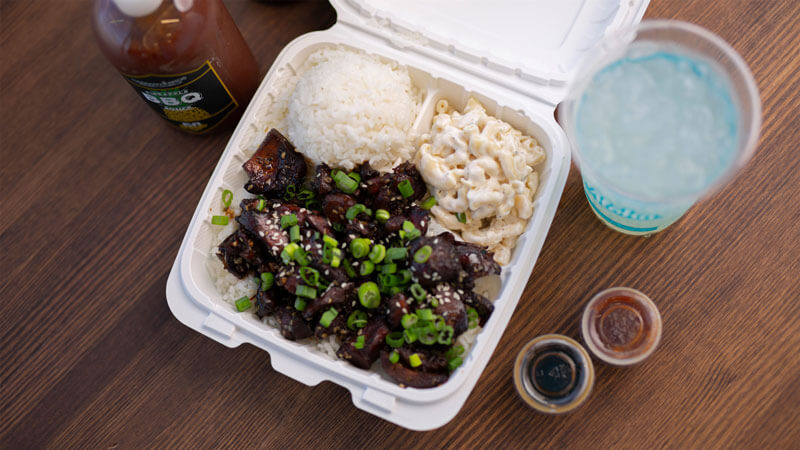 Honolulu Chicken plate lunch with macaroni salad, white rice, pineapple bbq sauce and a drink